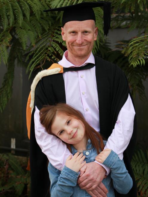 Platinum Recruitment director Dean Delaney with his daughter Harper (8) following his graduation...