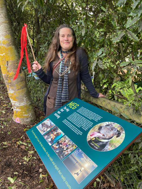 Designer Meg Brasell-Jones is pleased with the plaque she designed honouring the late canine...