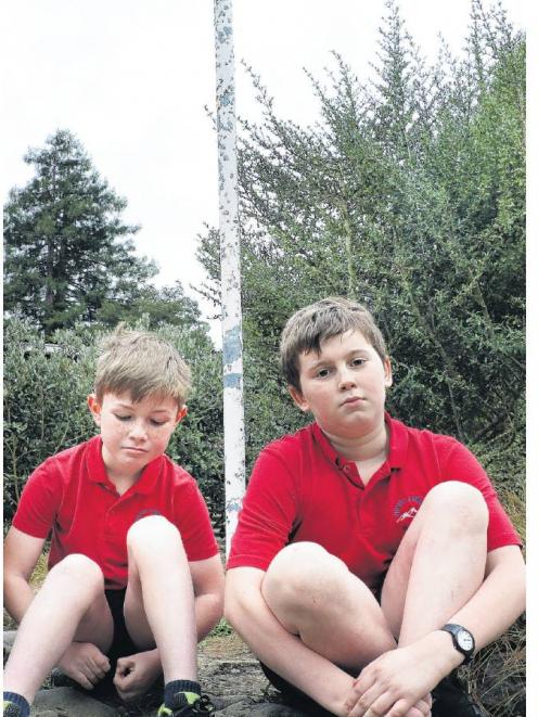 Empty hearts . . . From left Clyde Robinson 8 and Harry Whitaker 9, sit below where their school...