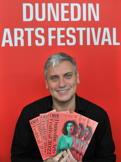 Dunedin Arts Festival director Charlie Unwin with the 2022 festival programme. PHOTO: SUPPLIED