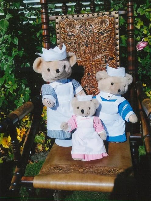 The bears wearing the different uniforms the girls received at each stage of their training and...