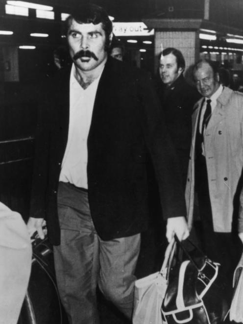 Keith Murdoch, wearing a blazer sans Silver Fern, arrives at Euston Station in London. Photo from...