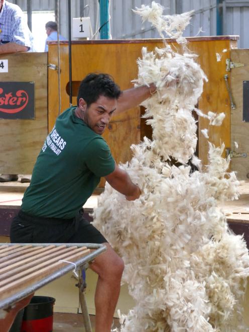 Joel Henare, of Gisborne, blends his second shear on the way to a 13th New Zealand Woolhandler of...