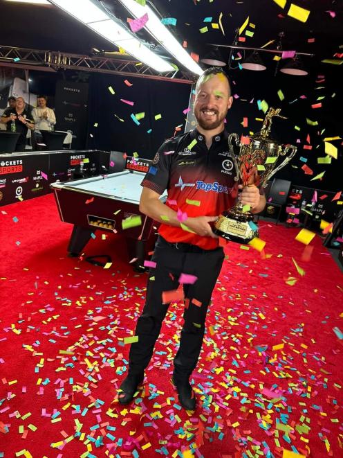 Queenstown pool player Simon Singleton celebrates after winning a round of the Pockets pro series...