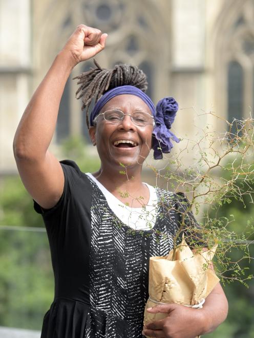 Zambia-born Namakau Nalumango (65) celebrates becoming a New Zealand citizen yesterday in Dunedin...