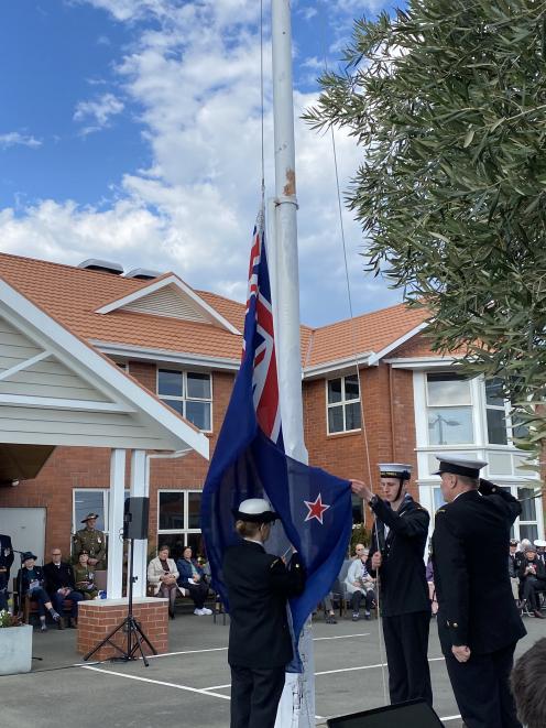 The Navy Ensign flag is raised on the Montecillo flagpole during Anzac Day commemorations.