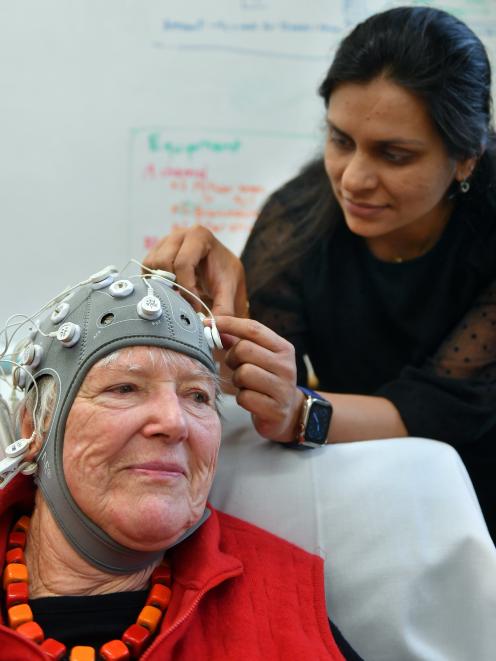 Dr Divya Adhia attaches cables to a cap covered with electrodes, which unexpectedly helped to...