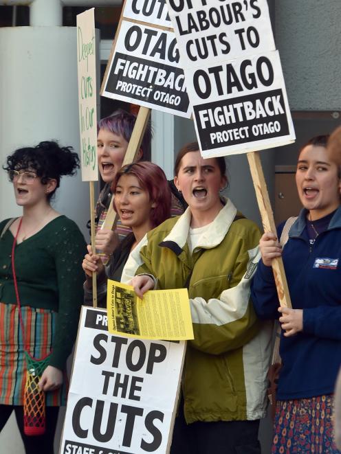 Protesters greet Prime Minister Chris Hipkins as he arrives to speak to University of Otago...