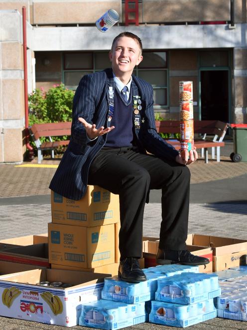 King’s High School pupil Declan Viljoen (16) displays the more than 600 cans he collected for...