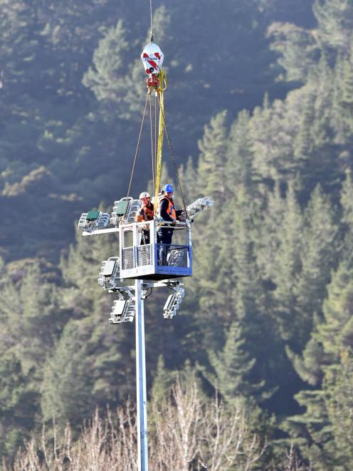 Workers put up lights at the Caledonian Ground in Dunedin this month in preparation for its use...