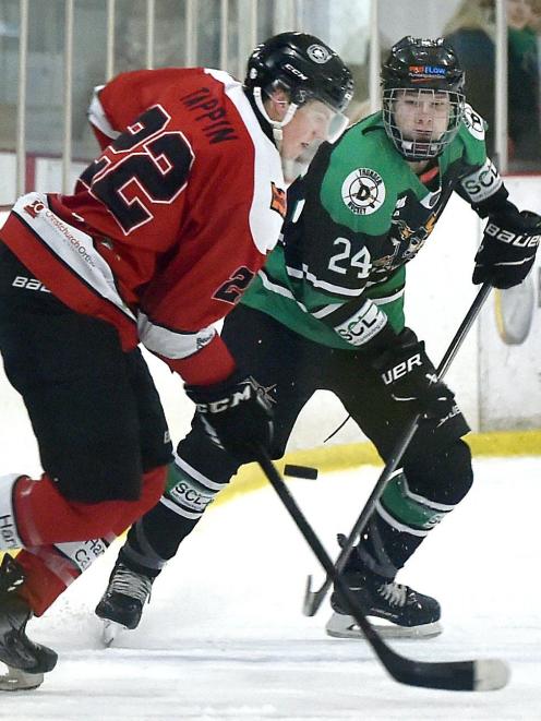 Dunedin Thunder forward Jack Lewis (right) tussles with Canterbury Red Devils defenceman Luke...