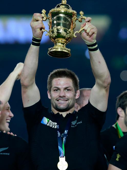 Richie McCaw hoists the 2015 Rugby World Cup high. PHOTO: GETTY IMAGES