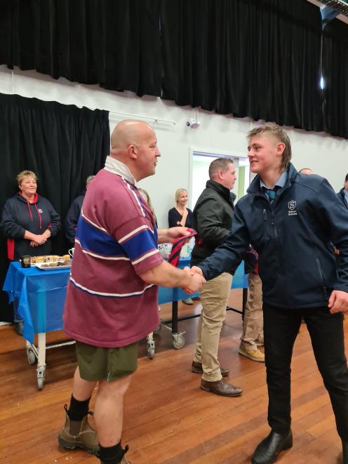 Dave Kempton, seen here congratulating Shaun when he was awarded his Selwyn Schools’ honours tie...