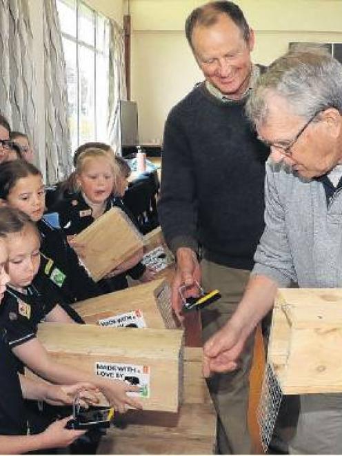 Richard Chambers (centre) and Lynn Andrews help the Kaiapoi Brownies learn how to operate their...