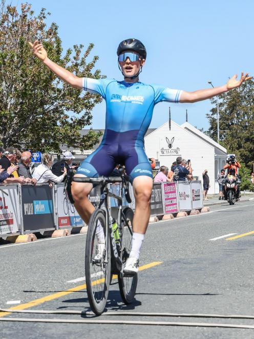 Australian Sam Jenner celebrates as he arrives in Lumsden to win stage two of the Tour of...
