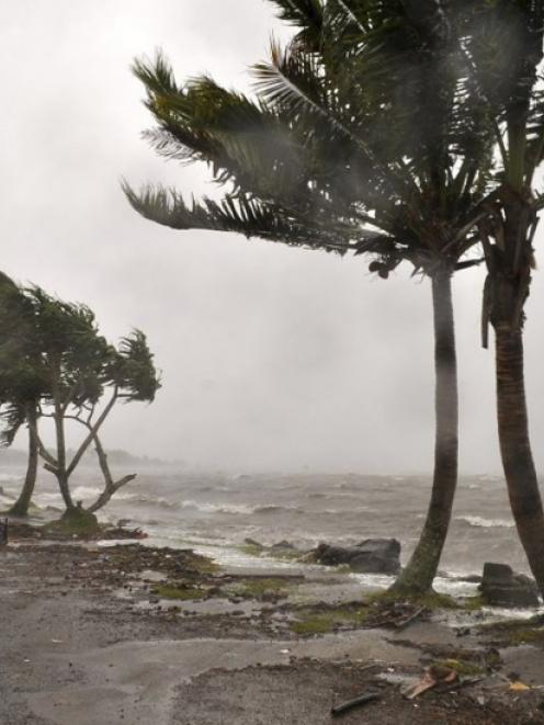 Strong waves caused by Cyclone Evan wash a beach in Queen Elizabeth Drive, in Suva. Photo from...