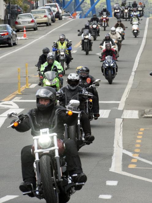 Motorcyclists ride through Port Chalmers towards Dunedin, as part of the Bronz Christmas toy run...