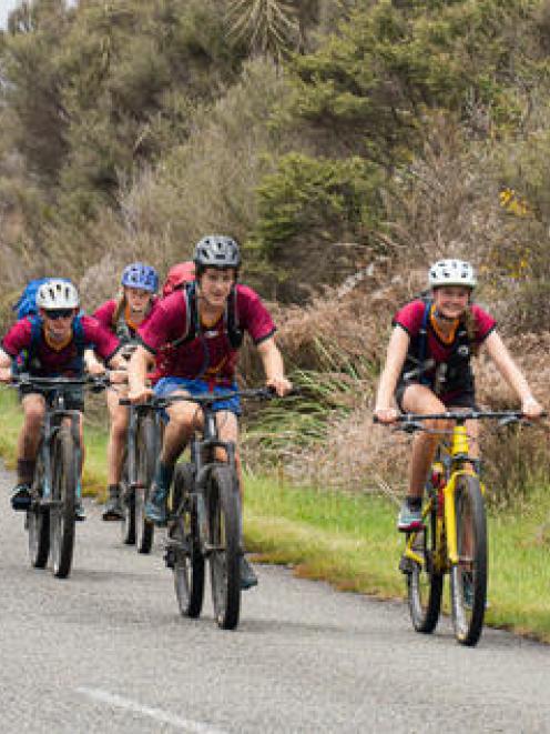AJ Williams, Anna Wright, Finn Groer and Elsie Brown complete the biking stage of the race....