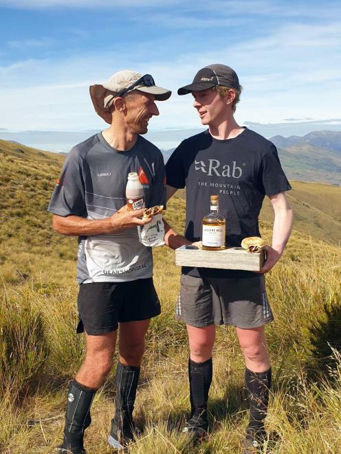 Darron Jones, left, and Fynn Mitchell celebrate finishing The Revenant ultra adventure race with...