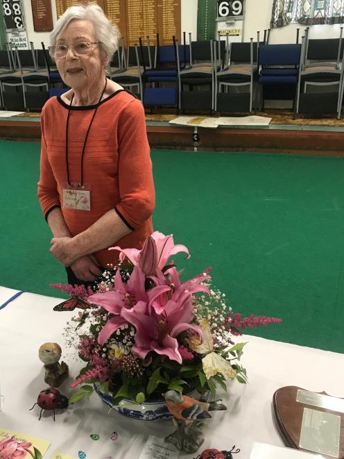 Celia Joyce presents her prizewinning floral art entry. PHOTO: GILLIAN VINE