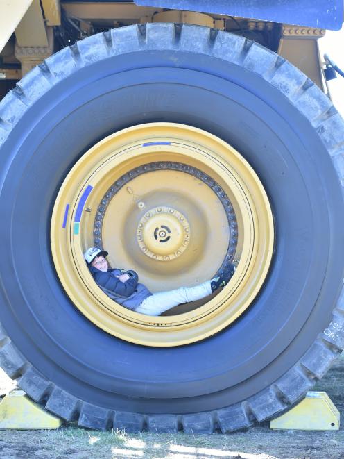 Alfie Rios (10), of Wanaka, kicks back on a Caterpillar haul truck at Wheels at Wanaka yesterday.