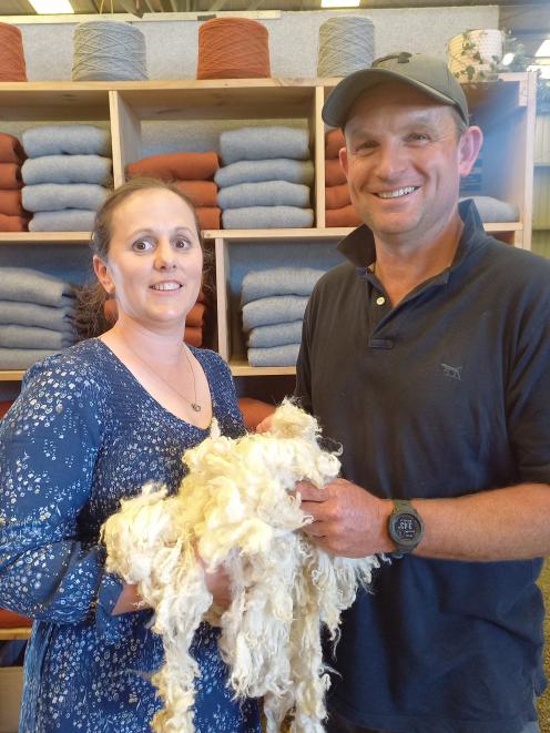 Esta and Tim Naylor hold their Romney lambs’ wool, which has been used to create the jerseys in...
