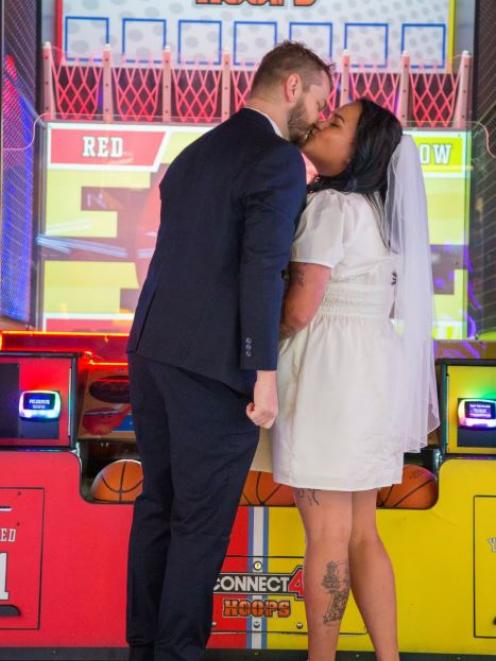 The newlyweds took on each other in a series of games including claw, bumper cars, mini golf and...