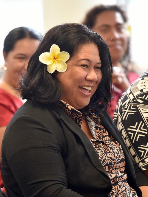 Pacific professor of psychology Siautu Alefaio reacts to a cultural welcome from members of the...