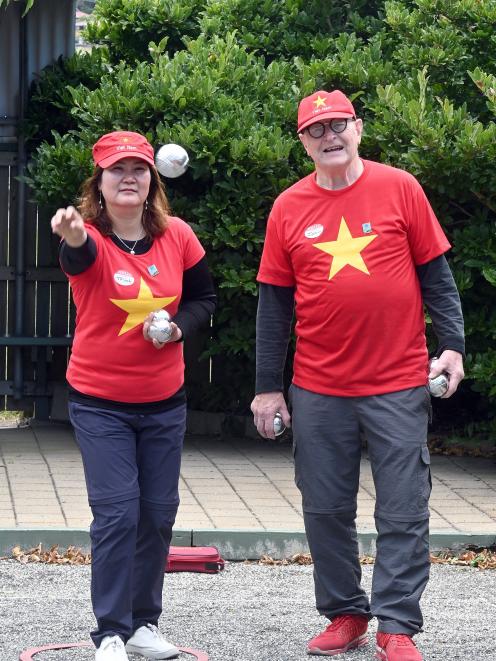 Trinh On and John Cuttance compete in the petanque at the Masters Games on Friday. PHOTO: LINDA...