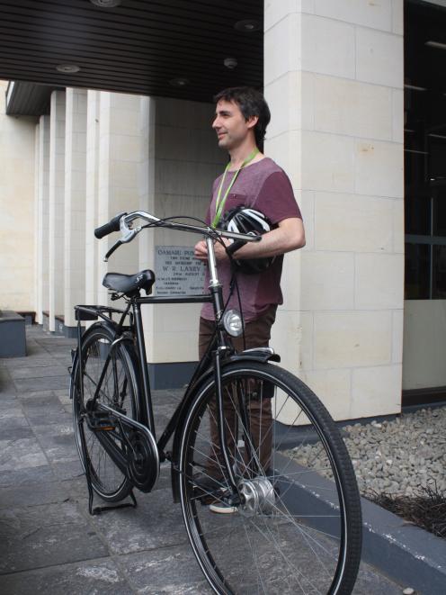 Librarian Martin Bratina stands with his bike outside the Oamaru Public Library where a cycle...