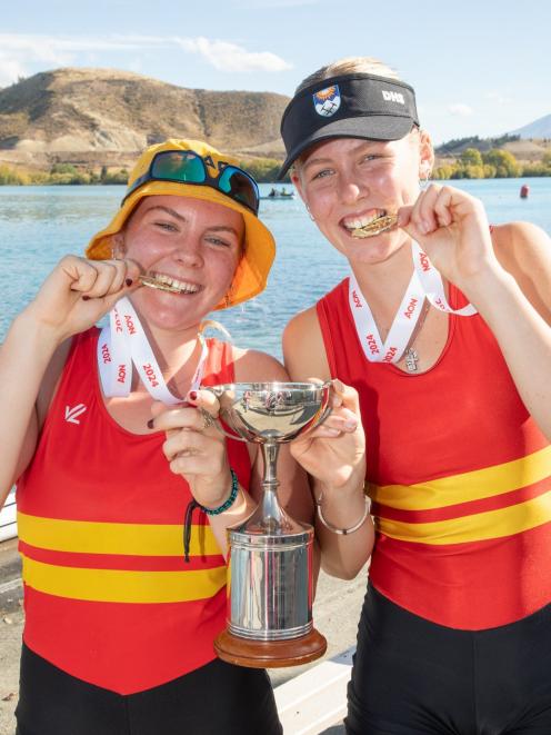 Celebrating their gold in the girls under-15 double sculls are Ruby Smith (left), 15, and Bella...