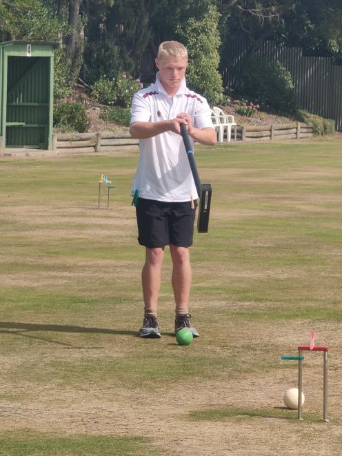 Gore Croquet Club player Max Philpott plays a shot during the Croquet New Zealand Don Reyland...