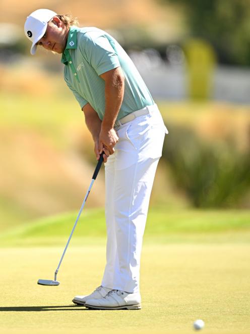 New Zealander Zach Swanwick putts yesterday. Swanwick won the Bledisloe Cup, awarded to the...