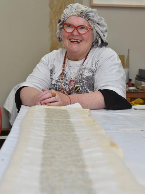 Dunedin artist Lesa Hepburn, who goes by Lesa Deluxe, displays the city’s longest miniature...