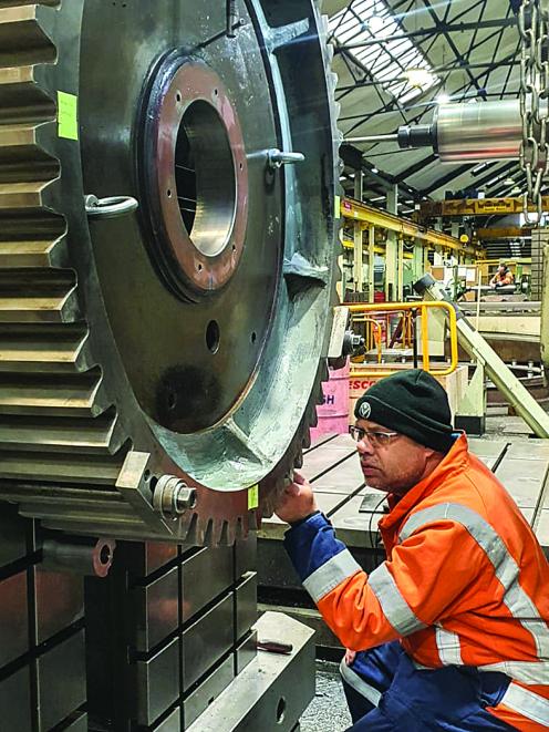 Machining - Machinist Andre checking large cog on the floor borer