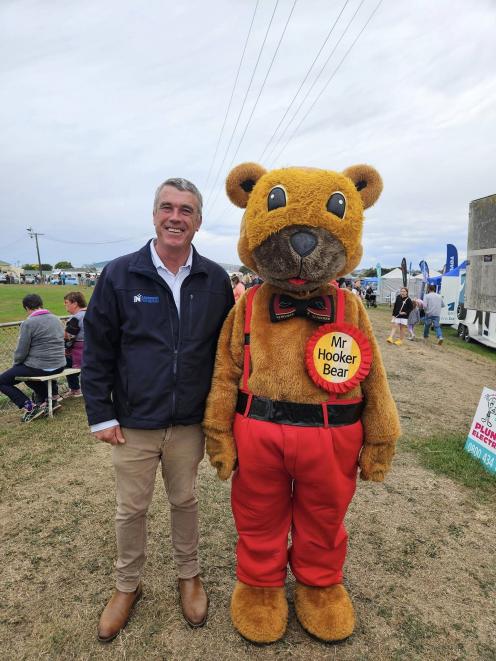 Waitaki National MP Miles Anderson and his new pal at the North Otago A&P Show. PHOTO: SUPPLIED