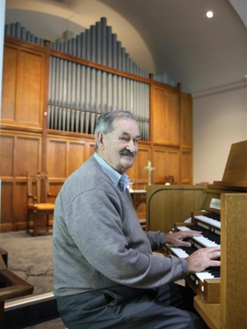 Baring Square Methodist Church parish steward Alister Smyth with the church’s new organ. Photo:...