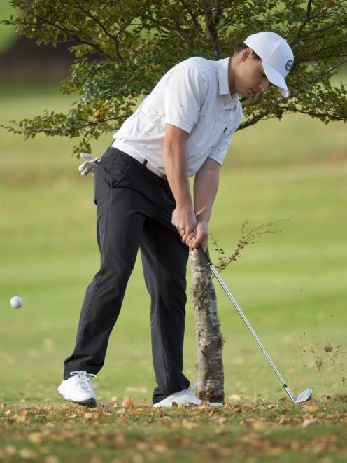 Queenstown golfer Josh Harris chips out from a tight spot.