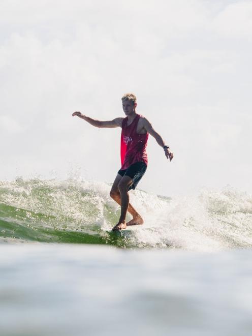 Jack Tyro won the men's open competition at the Noosa Longboard Festival of Surfing in Queensland...