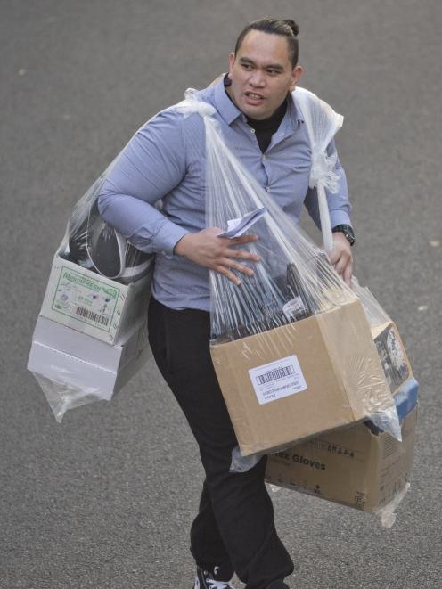 Iraia Burton, seen here leaving the Dunedin District Court with his personal belongings, was...