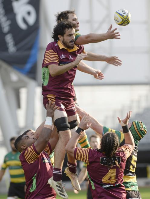 Adam McNeill (Alhambra-Union) and Ronan Dynes (Green Island) contest a lineout at Forsyth Barr...
