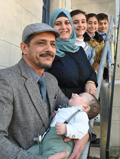 The Al Turk family (from left) Malek holding Ameer, 6 months old, Razan, Siham, 11, Jana, 9, and...