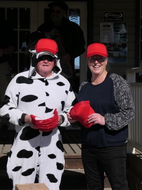 John Courtney, of Auckland, and St John’s School teacher Heather Dowling, show off some caps...