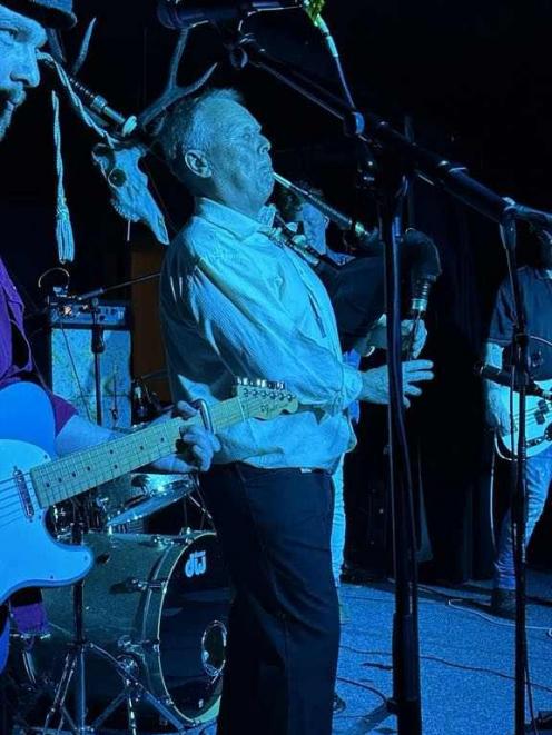 Brenny (Brendon Fairbairn) blows up his bagpipes along with his band the Bushwhackers at their...