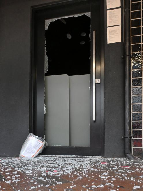 Glass litters lower Stuart St after the front door of Pizza Bar was smashed early yesterday...