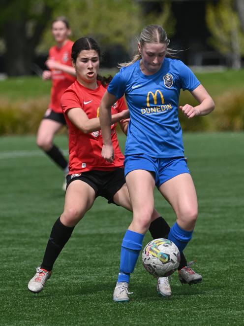 Southern player Abby Rankin tries to control the ball under the pressure of Canterbury player...