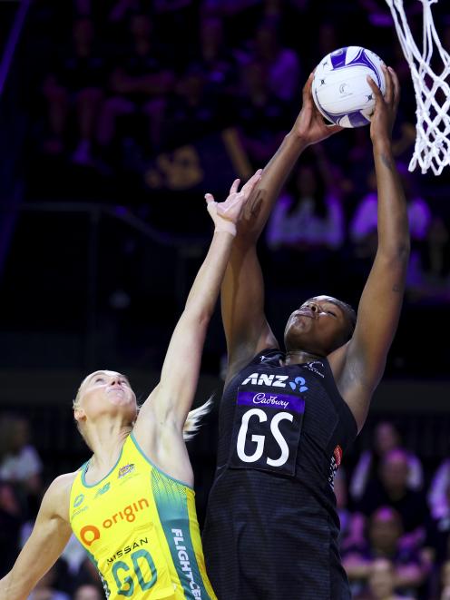 Silver Ferns shooter Grace Nweke takes the ball under the pressure of Diamonds defender Jo Weston...