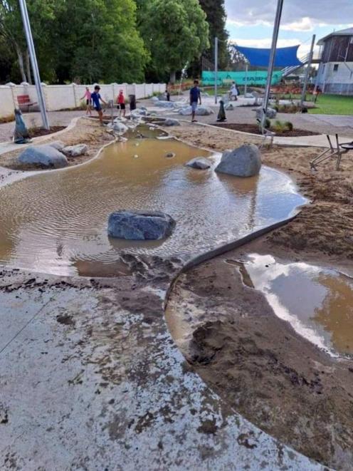 The Oamaru Public Gardens’ new water play area was left clogged and muddy after would-be...
