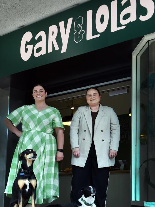 Gary & Lola’s co-owners Katelyn Waugh (left) and Sammy Sinclair greet customers with 6-year-old...