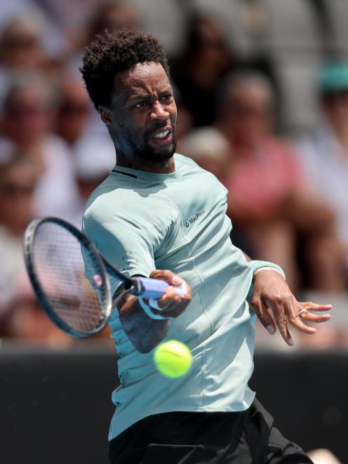 Gael Monfils, of France, plays a forehand in his semifinal match against Nishesh Basavareddy, of...